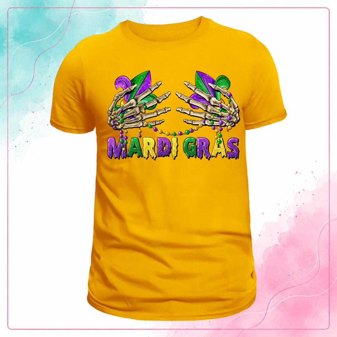 Yellow Mardi Gras T-shirt with skeleton hands, fleur-de-lis, bead necklaces, and purple, green, and gold lettering.