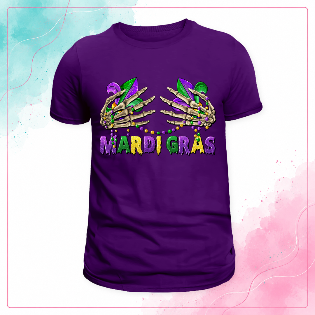 Purple Mardi Gras T-shirt with skeleton hands, fleur-de-lis, bead necklaces, and purple, green, and gold lettering.