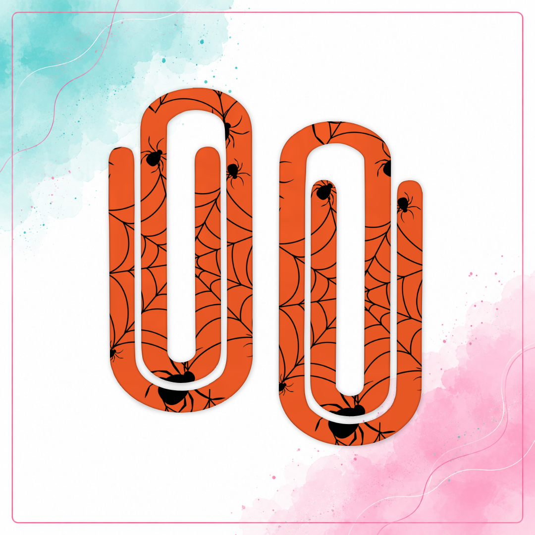 Creepy Crawly Spiderweb Jumbo Paper Clips with black spiders and webs on an orange background