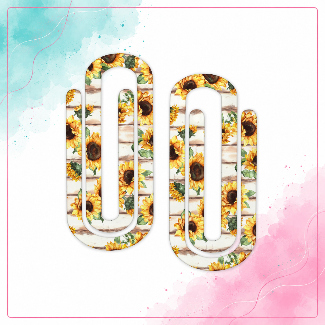 Rustic Sunflower Jumbo Paper Clips with yellow sunflowers and green leaves on a whitewashed wood background