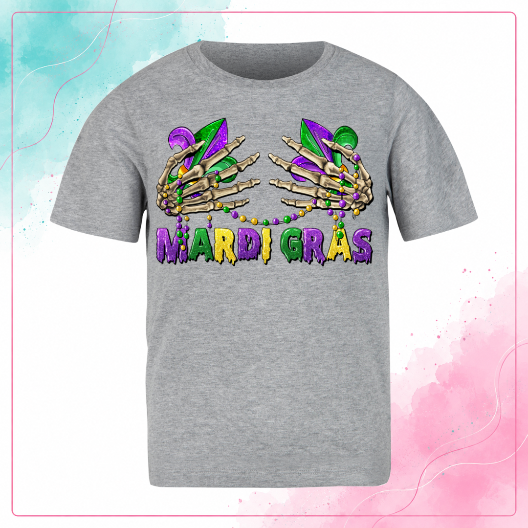 Gray Mardi Gras T-shirt with skeleton hands, fleur-de-lis, bead necklaces, and purple, green, and gold lettering.