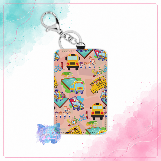 Colorful School Days keychain card holder with school buses, books, pencils, and classroom supplies